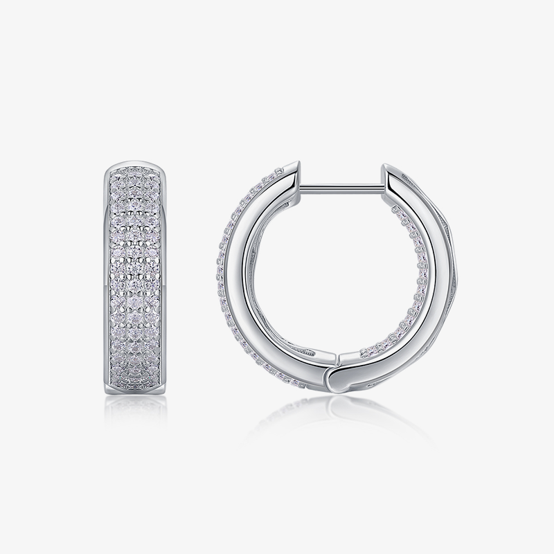 Moissanite huggie hoops in white gold vermeil with pavé stones, front view.