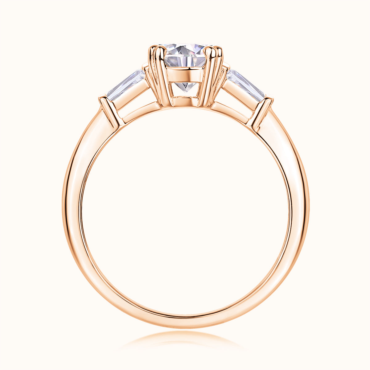 Three-stone round moissanite engagement ring, top view, rose gold vermeil setting