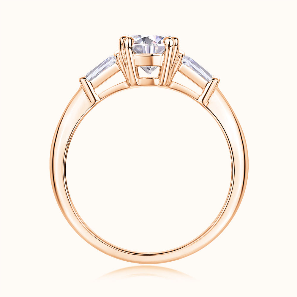 Three-stone round moissanite engagement ring, top view, rose gold vermeil setting