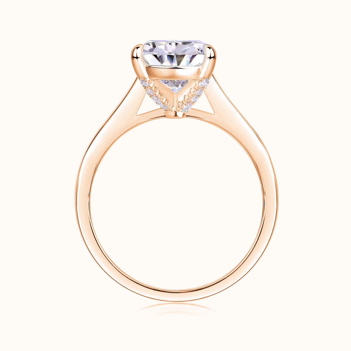 Rose gold vermeil pear-cut solitaire moissanite ring, side view of prongs and band