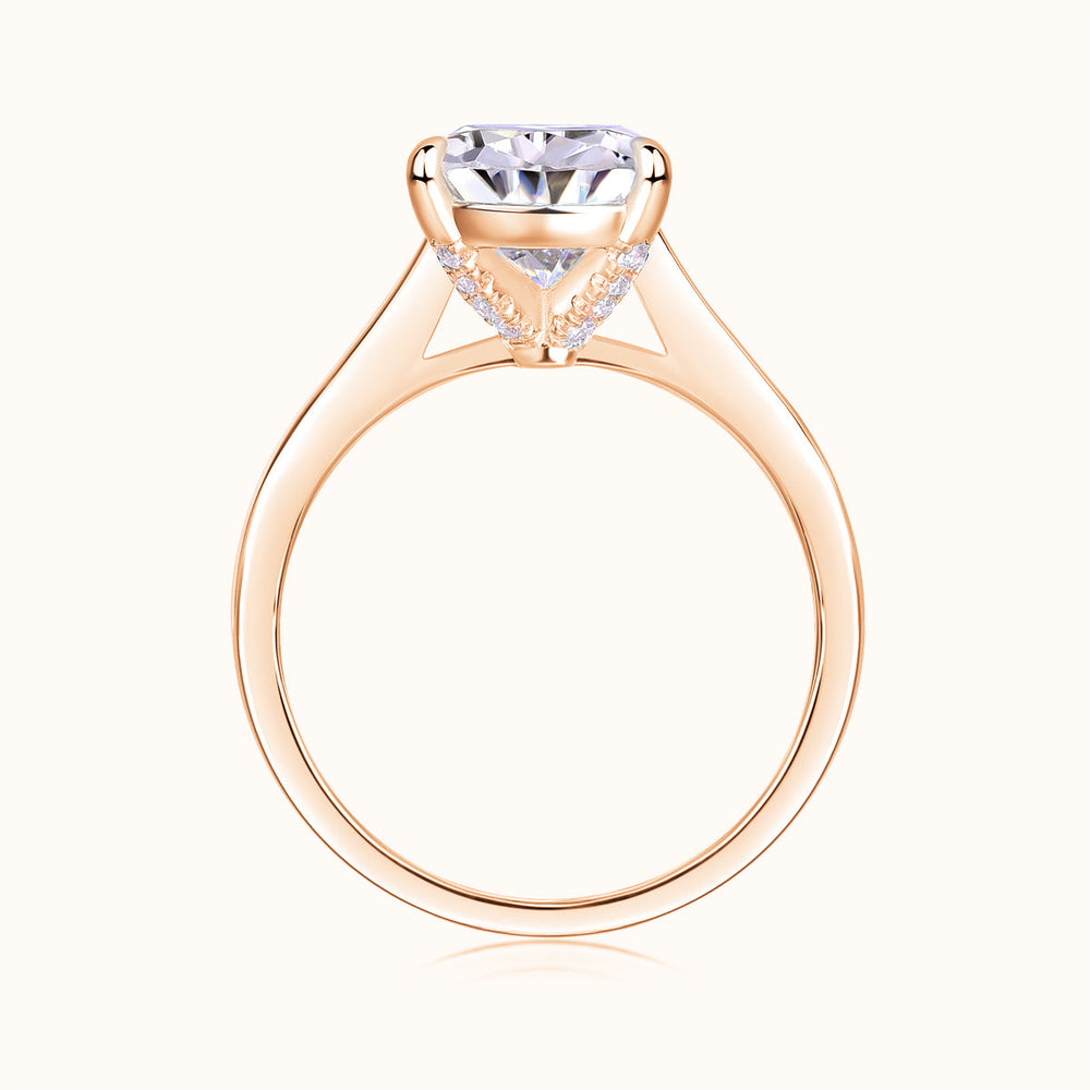 Rose gold vermeil pear-cut solitaire moissanite ring, side view of prongs and band