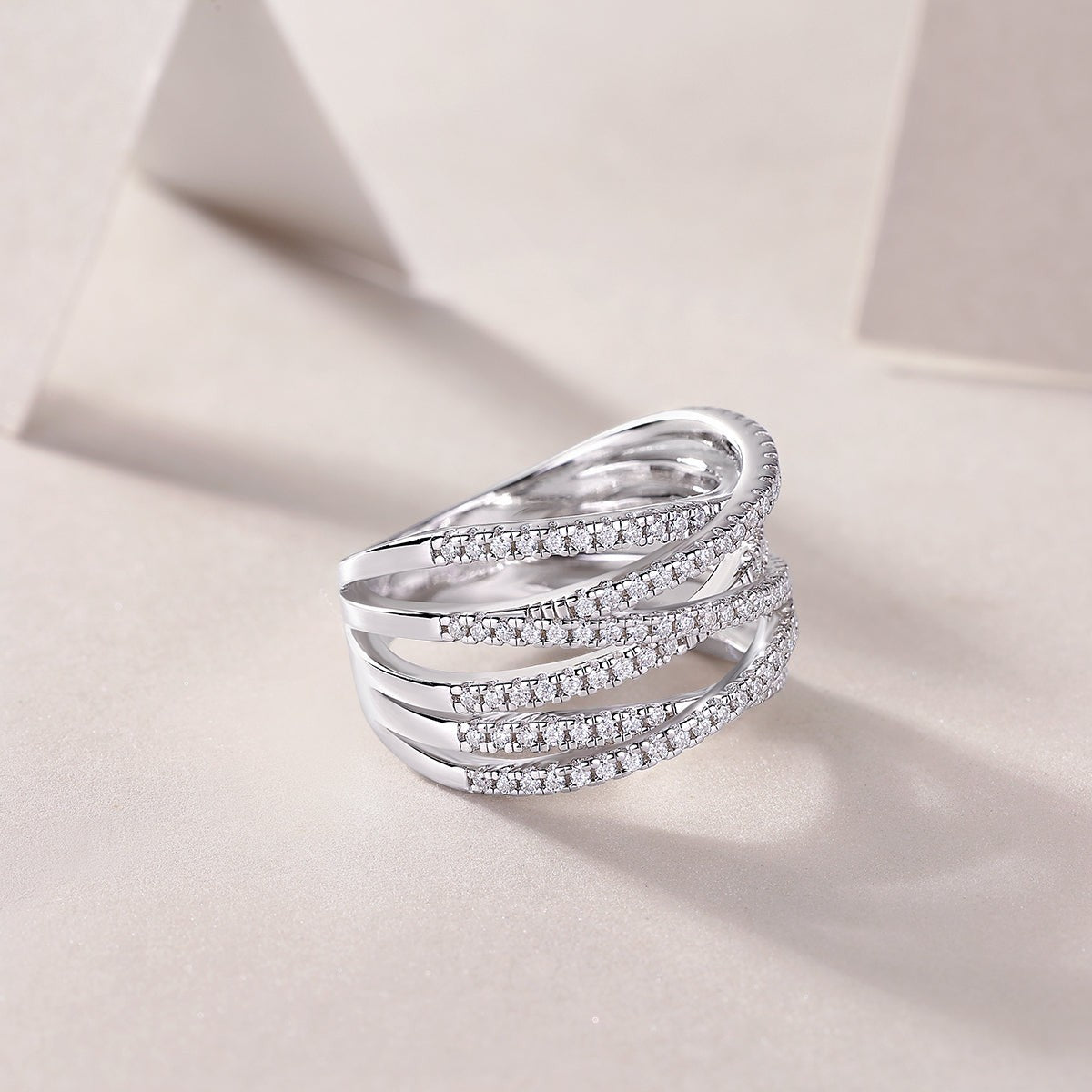 Crisscross moissanite crossover band with three pavé rows, side view