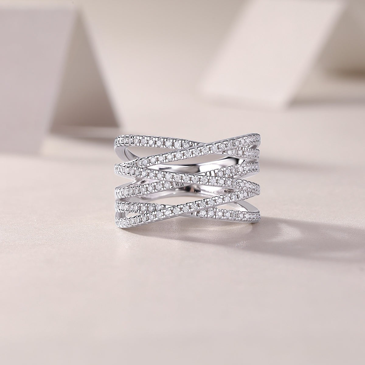 Crossover moissanite band, multi-row pavé with crisscross front profile