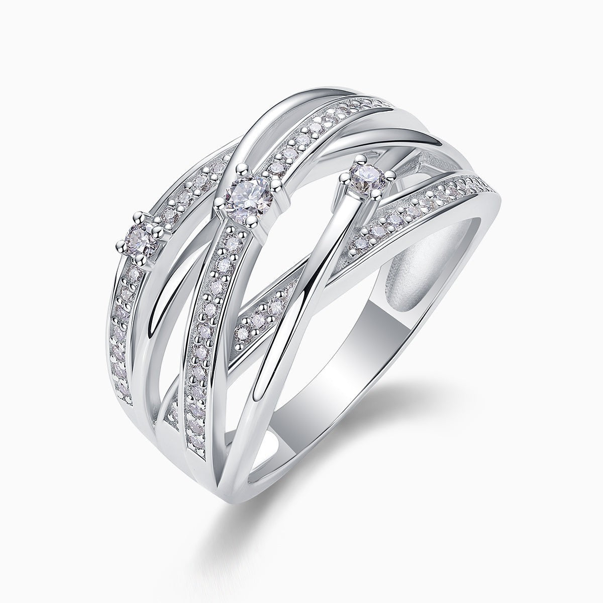 Angled view of crossover wide band ring with round prong-set moissanite and pavé