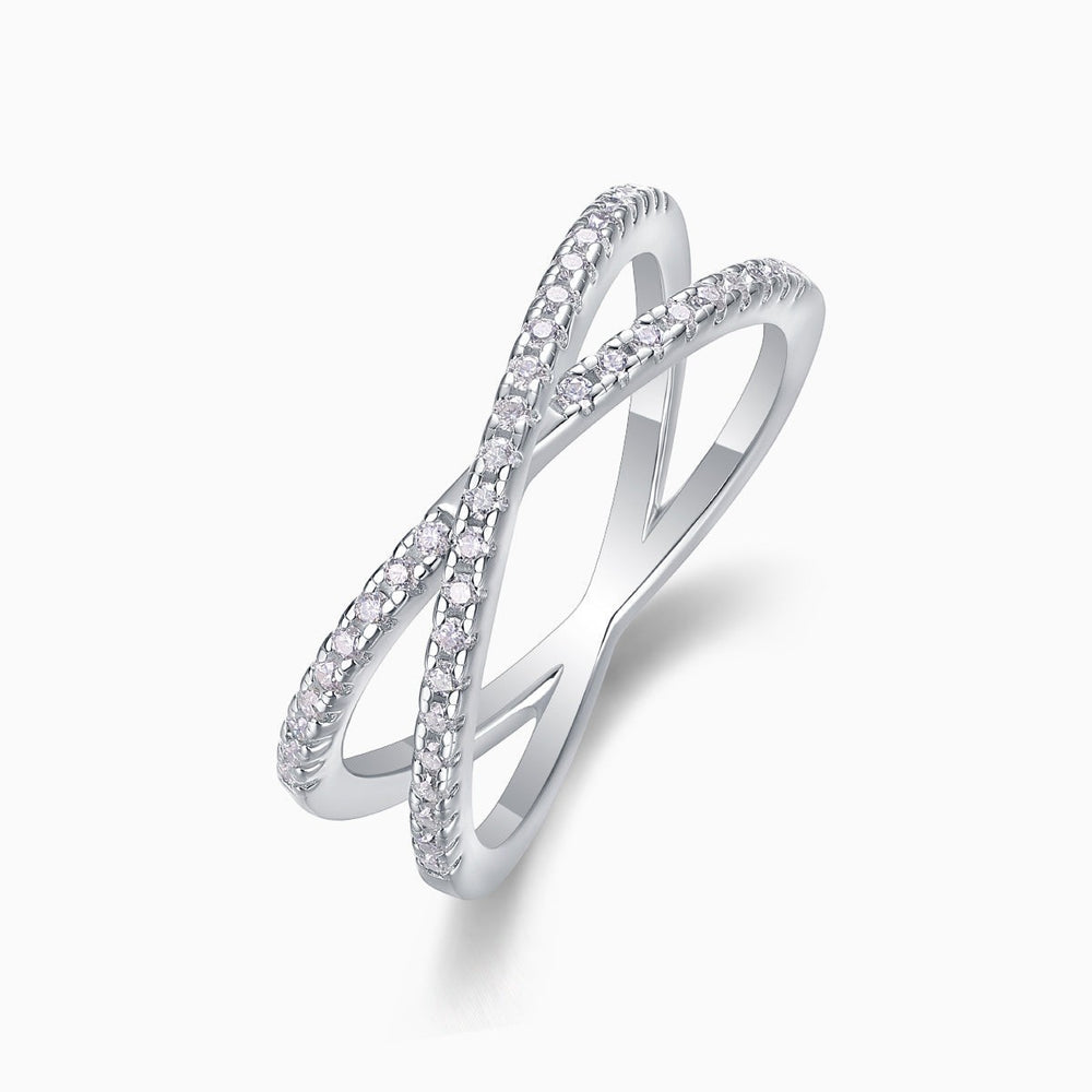 X-Cross Moissanite pavé band angled view showing stone-set crossover on white metal