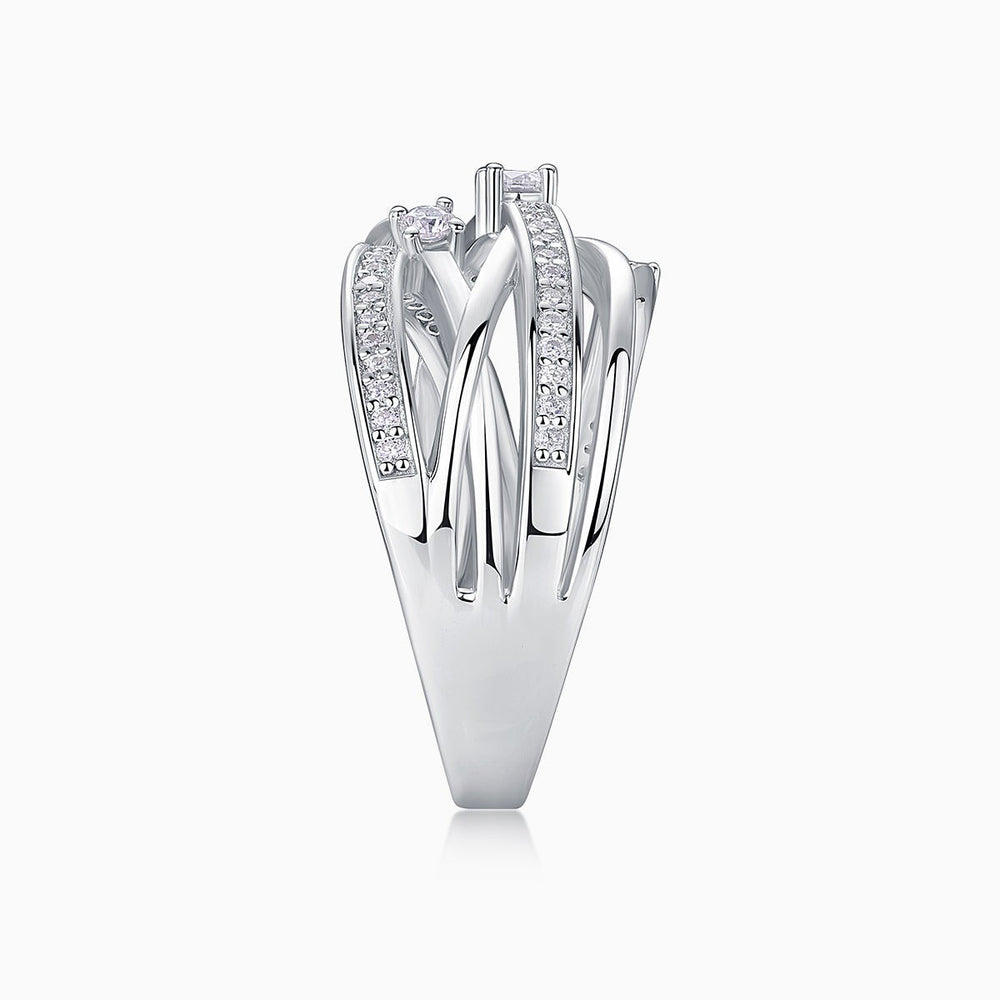 Side view of crossover wide band ring, tall setting with pavé and round center stone