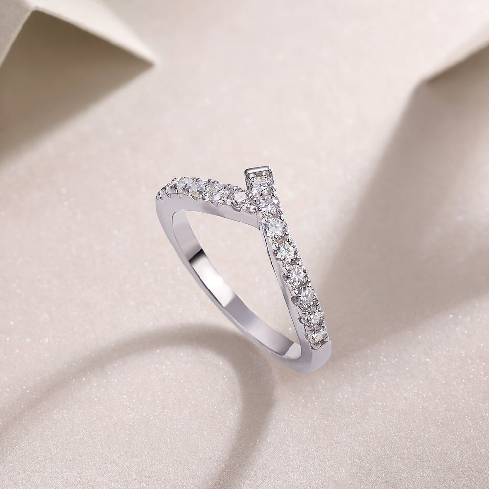 Curved pavé moissanite band, white gold vermeil, angled view of prong-set stones