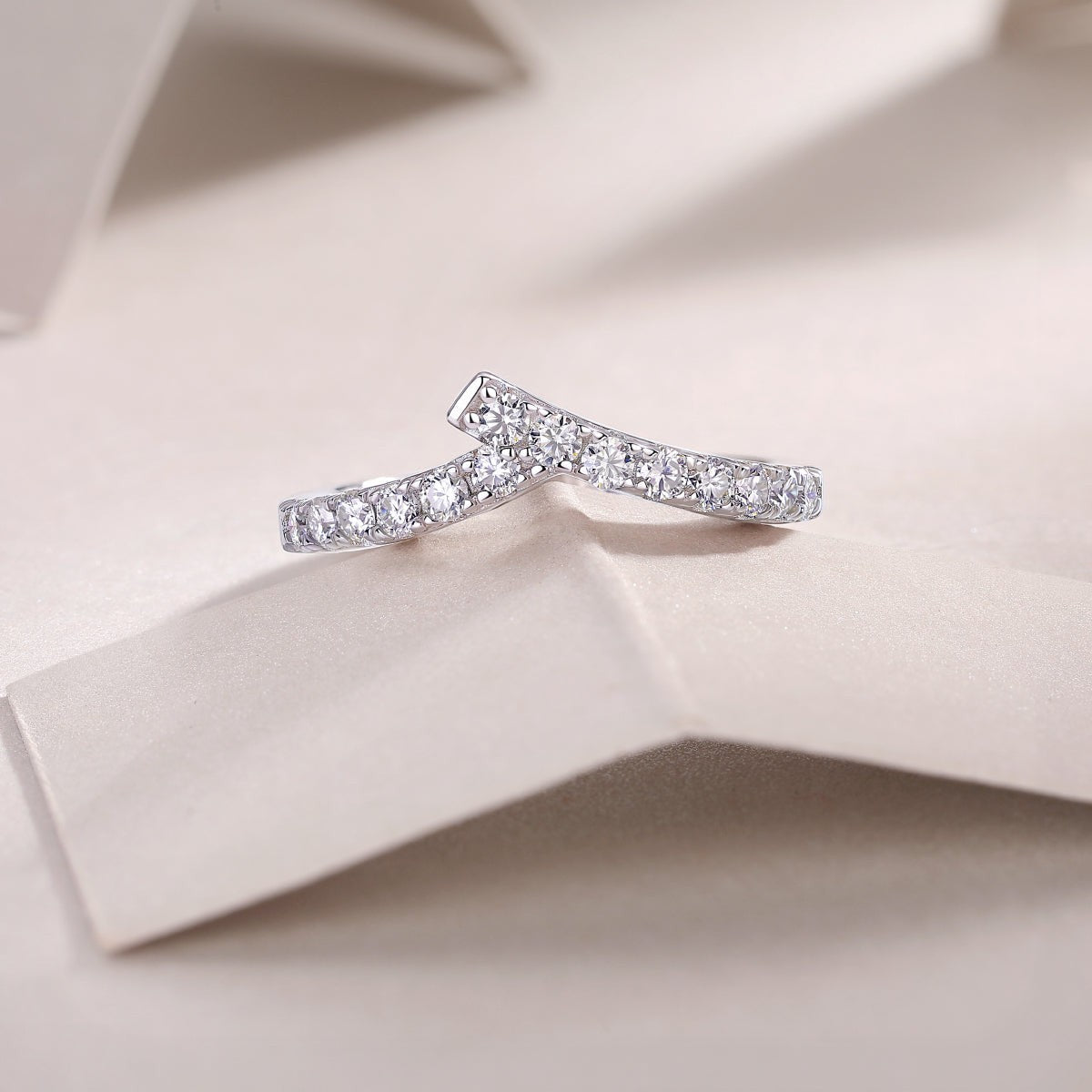 Curved pavé moissanite wedding band, white gold vermeil, profile view with stones