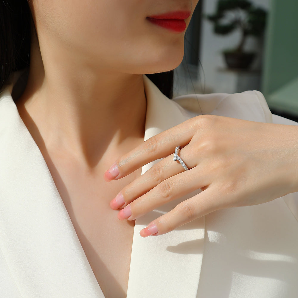 Curved pavé moissanite wedding band on hand, white gold vermeil with small round stones