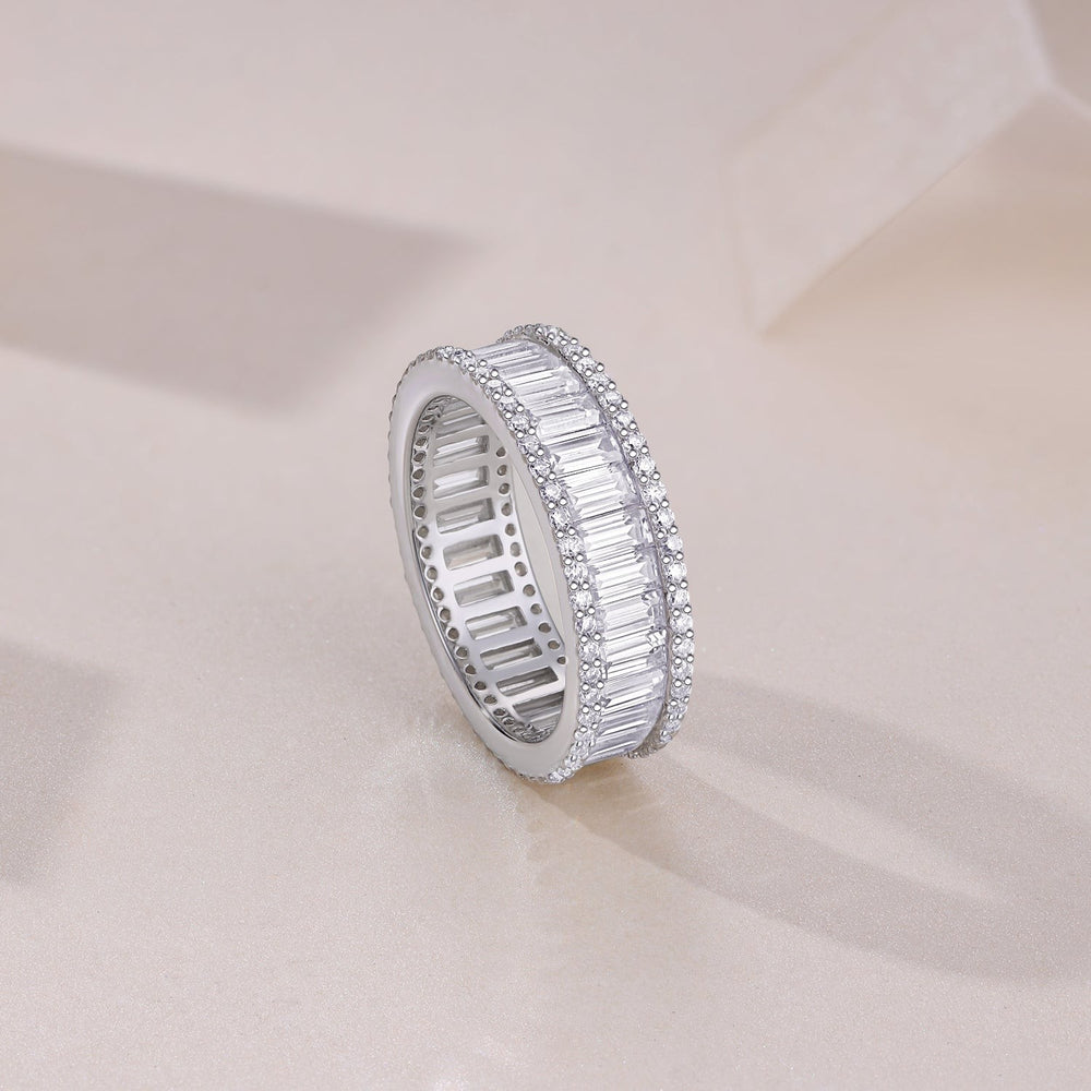 Cylen emerald-cut eternity band side view with rectangular stones, pavé border