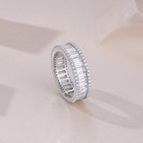 Cylen emerald-cut eternity band side view with rectangular stones, pavé border