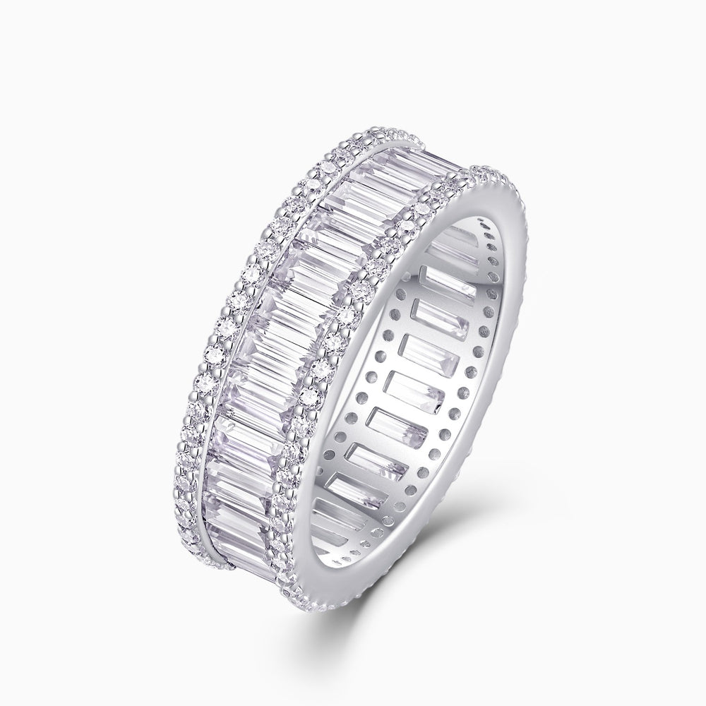 Angled emerald-cut eternity band with pavé frame and rectangular stones