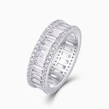Angled emerald-cut eternity band with pavé frame and rectangular stones