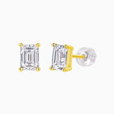Emerald cut moissanite stud earrings with yellow gold vermeil prongs and clear stone