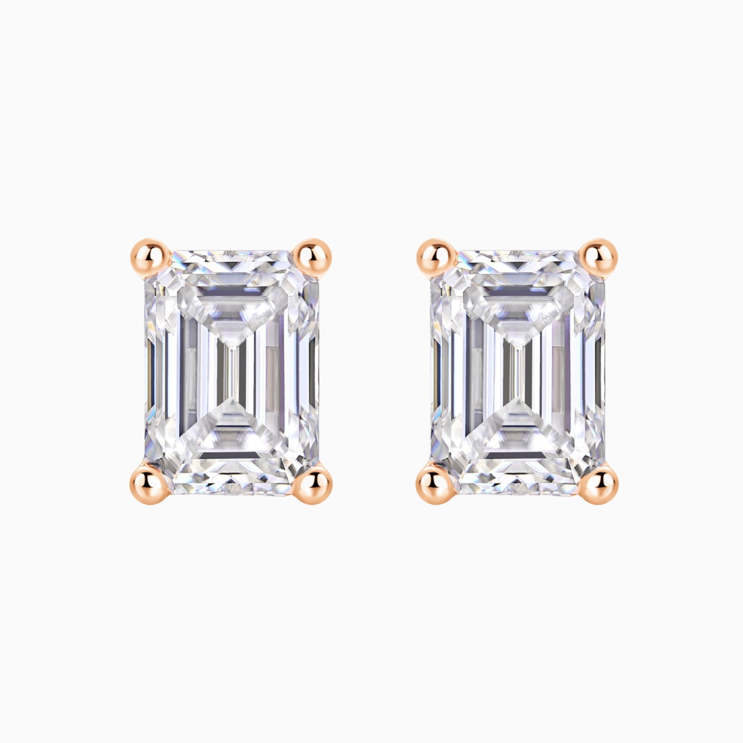Pair of emerald cut moissanite stud earrings in rose gold vermeil
