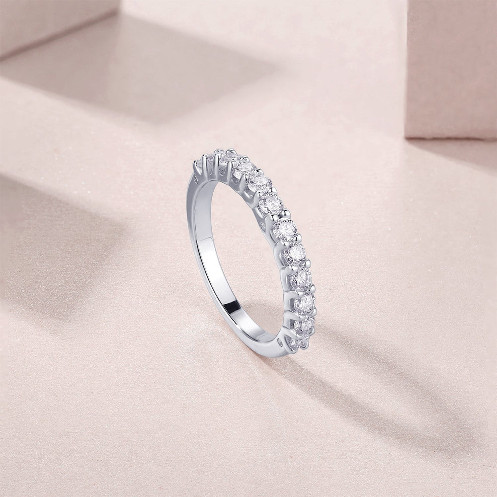 White gold vermeil half pavé eternity band with continuous row of round moissanite