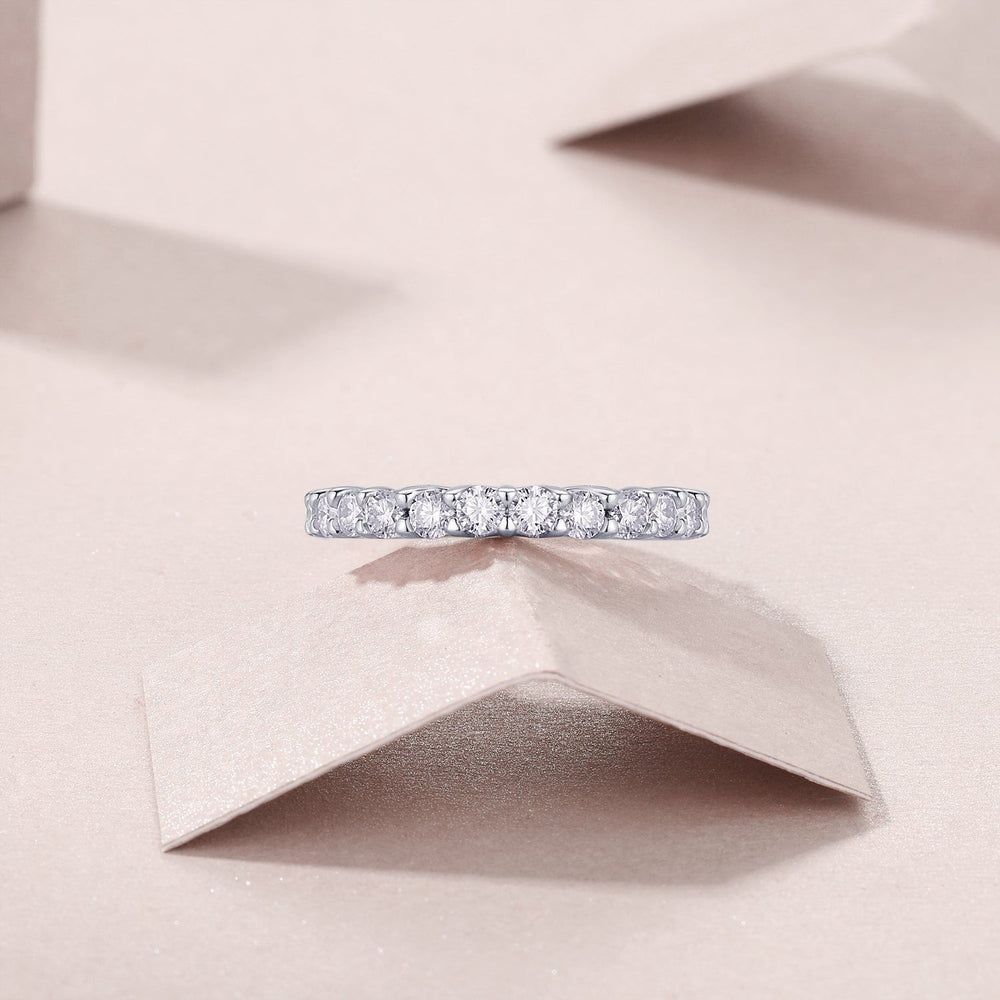 Half pavé eternity band, white gold vermeil, close view of round moissanite stones