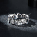 Heart moissanite band with six raised hearts, white gold vermeil finish
