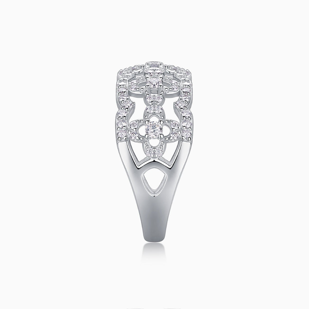 Moissanite band ring with openwork hollow cutouts and pavé stones on the shank