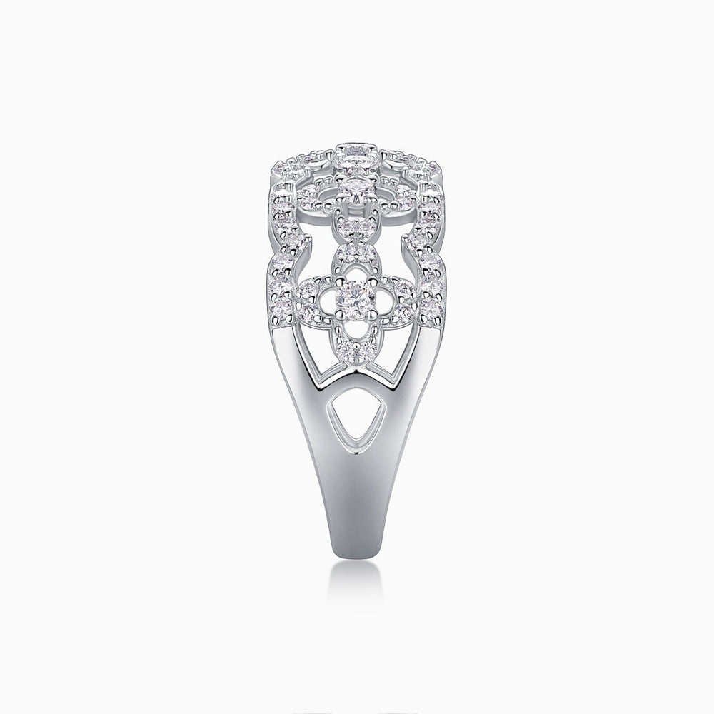 Moissanite band ring with openwork hollow cutouts and pavé stones on the shank