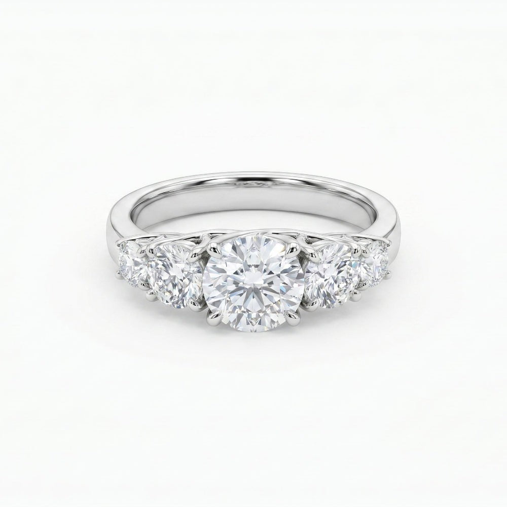 Five-stone moissanite anniversary band with central round stone and four side stones, silver-toned