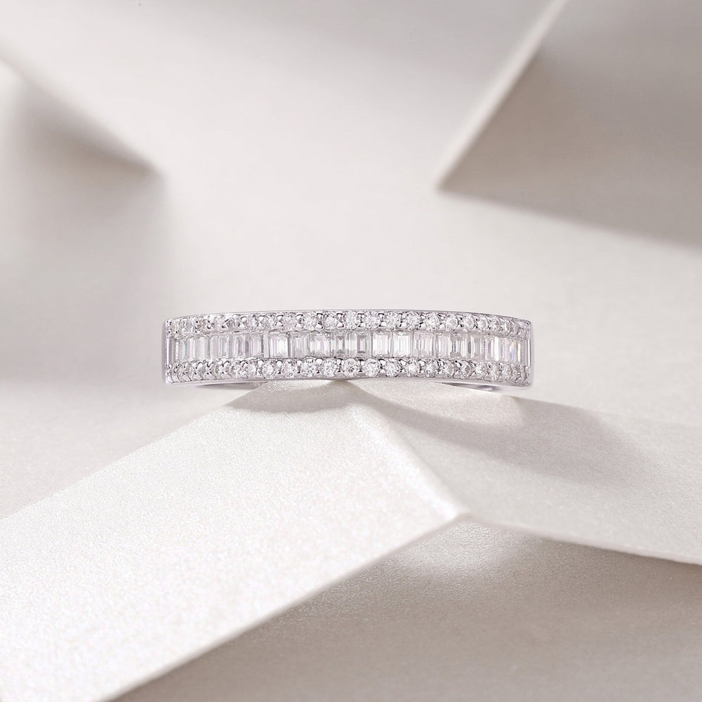 Moissanite half-row stacking band ring, white gold vermeil, angled view of paved top