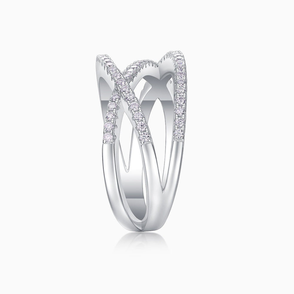 Criss-cross wide band moissanite ring with slim prongs and pavé stone rows
