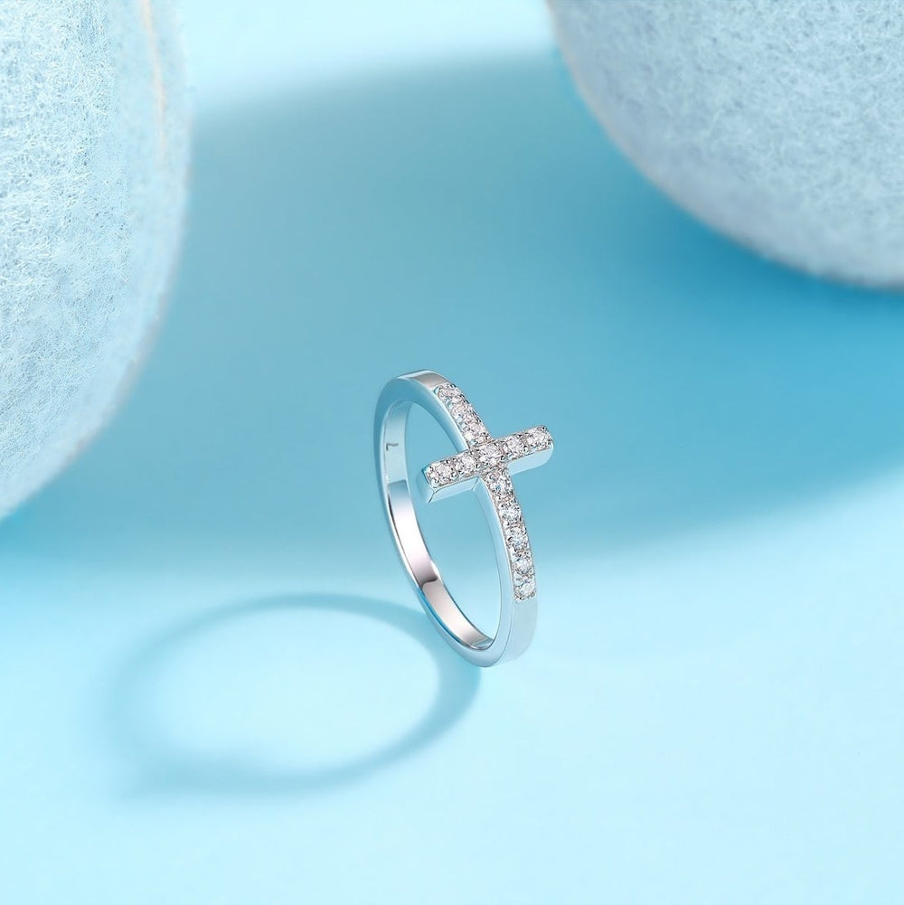 Thin cross band ring, profile view with moissanite pavé cross on metal shank