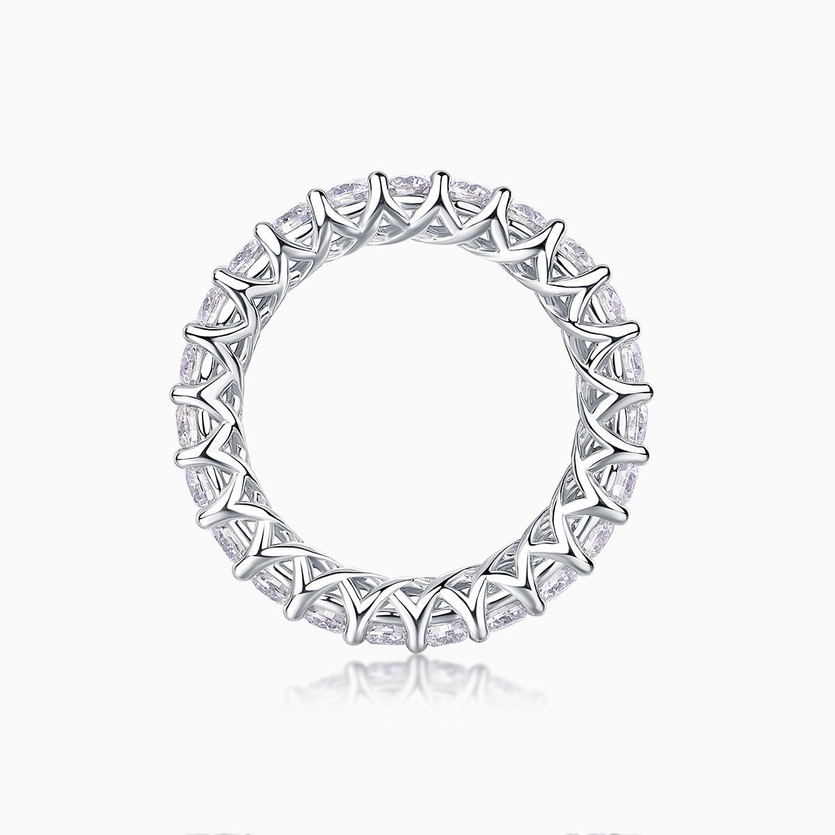 Top view of moissanite eternity band showing openwork metalwork and round pavé stones