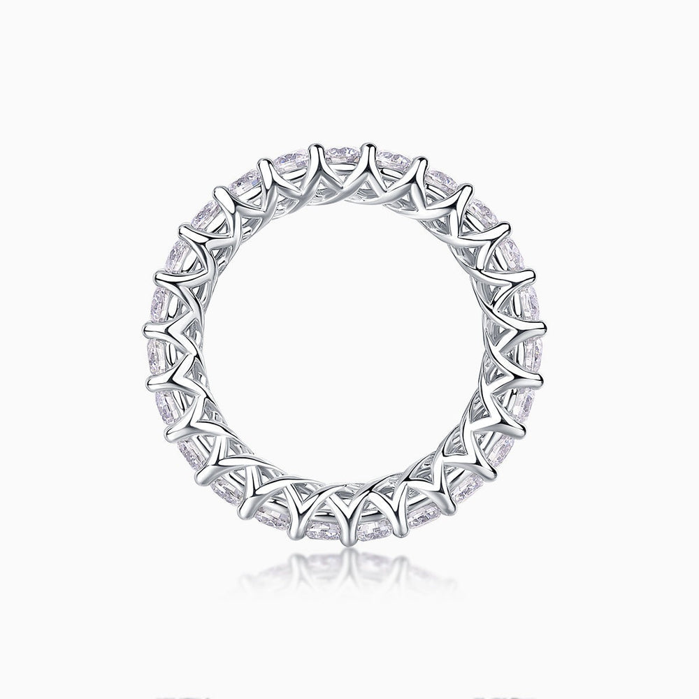 Top view of moissanite eternity band showing openwork metalwork and round pavé stones