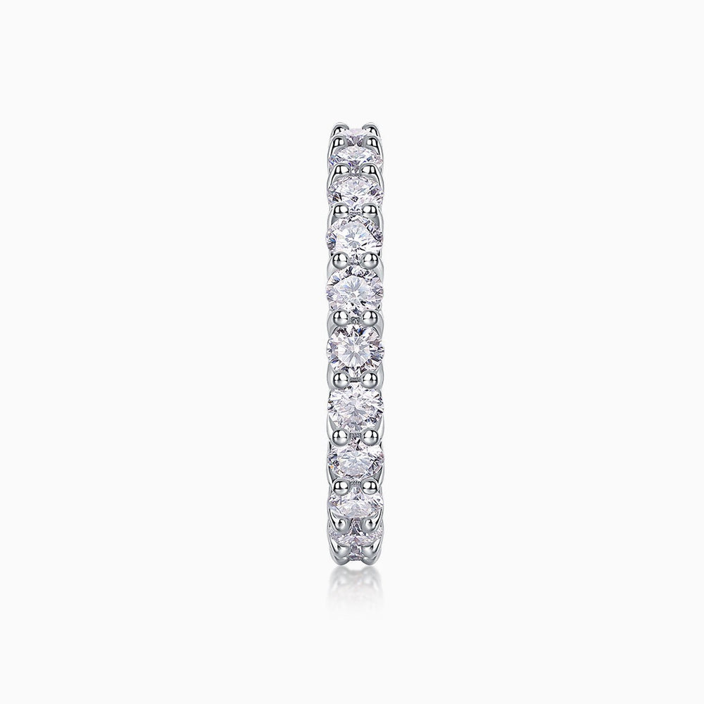 Vertical side profile of pavé eternity band with round moissanite stones, white gold vermeil