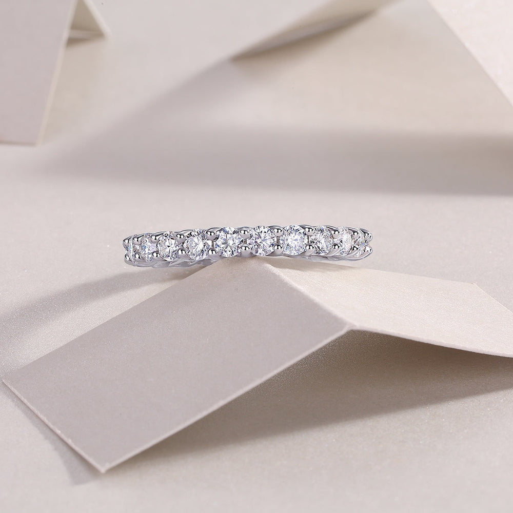 White gold vermeil pavé eternity band with evenly spaced round moissanite stones