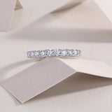 White gold vermeil pavé eternity band with evenly spaced round moissanite stones
