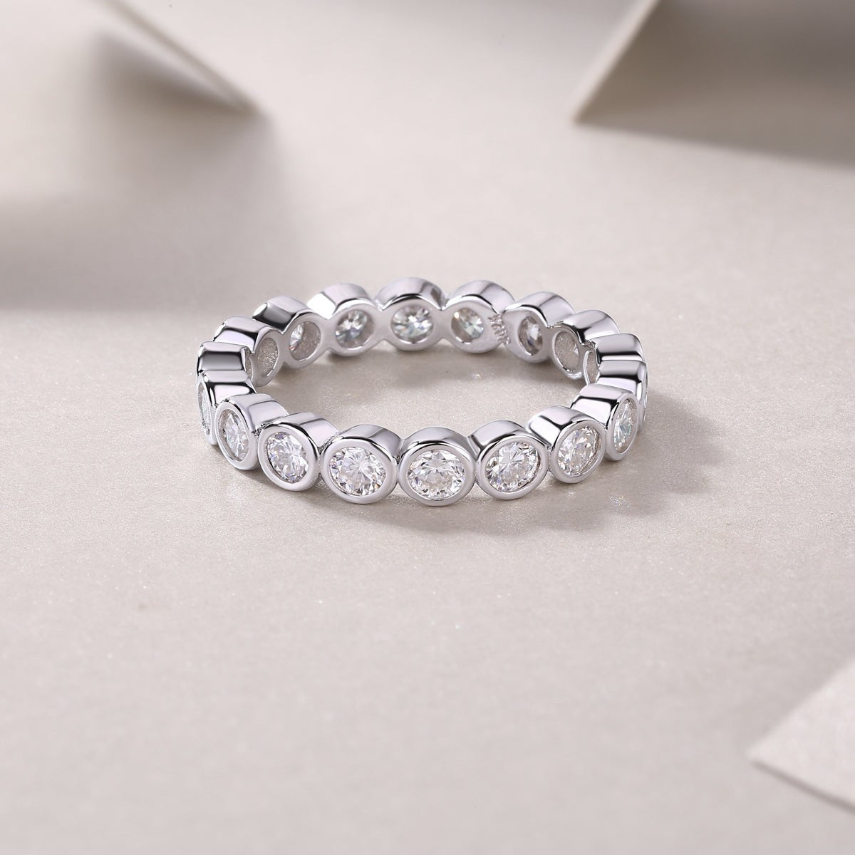 White gold vermeil eternity band ring with continuous round stones, close-up