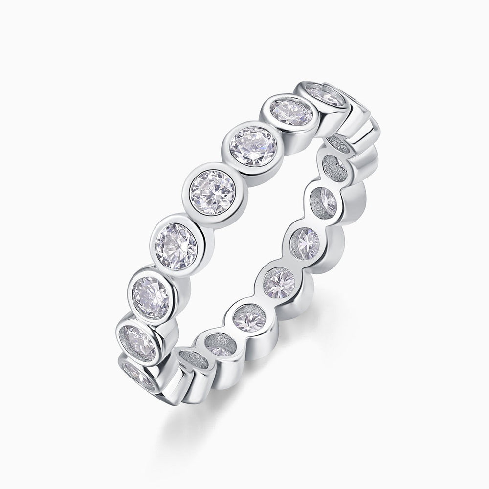 White gold vermeil eternity band with alternating round moissanite settings
