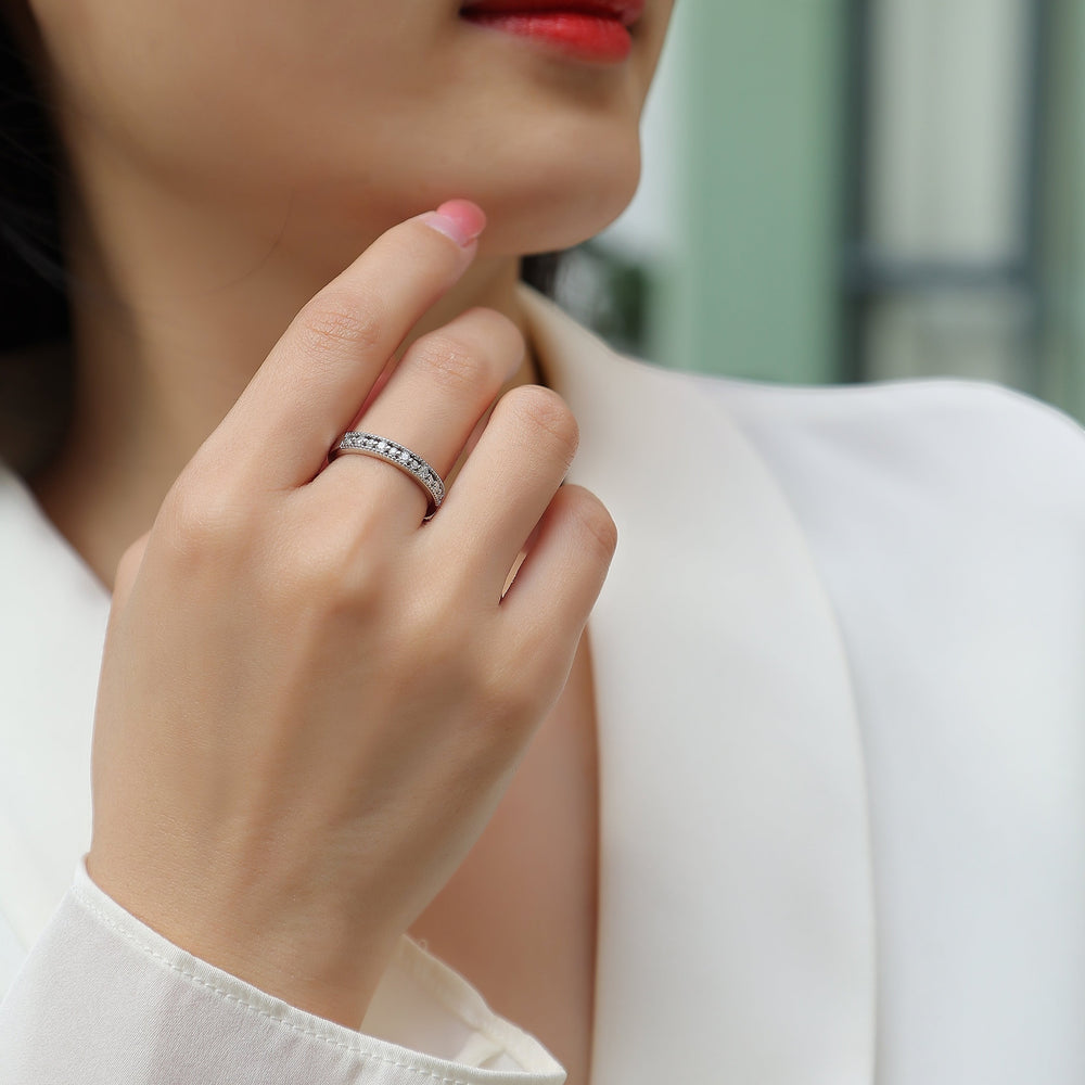 Moissanite half pavé eternity band on finger, white gold vermeil with round stones