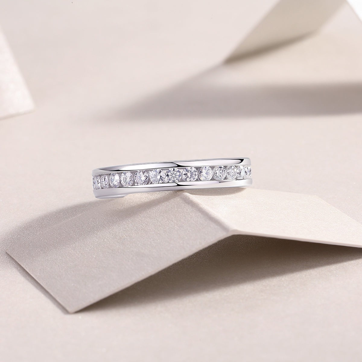 Round moissanite eternity ring, side profile with continuous row of round stones