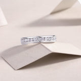 Round moissanite eternity ring, side profile with continuous row of round stones