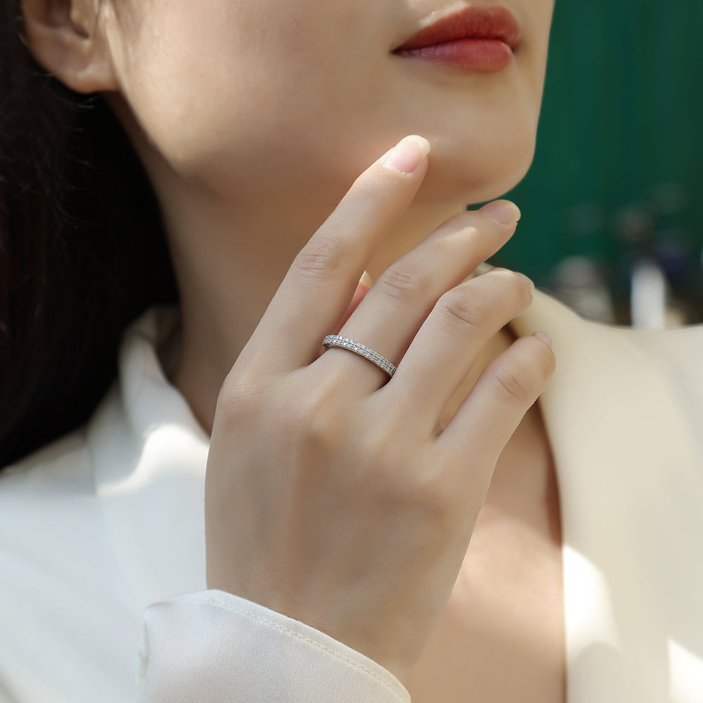 White gold vermeil moissanite half eternity band on finger, full row of stones
