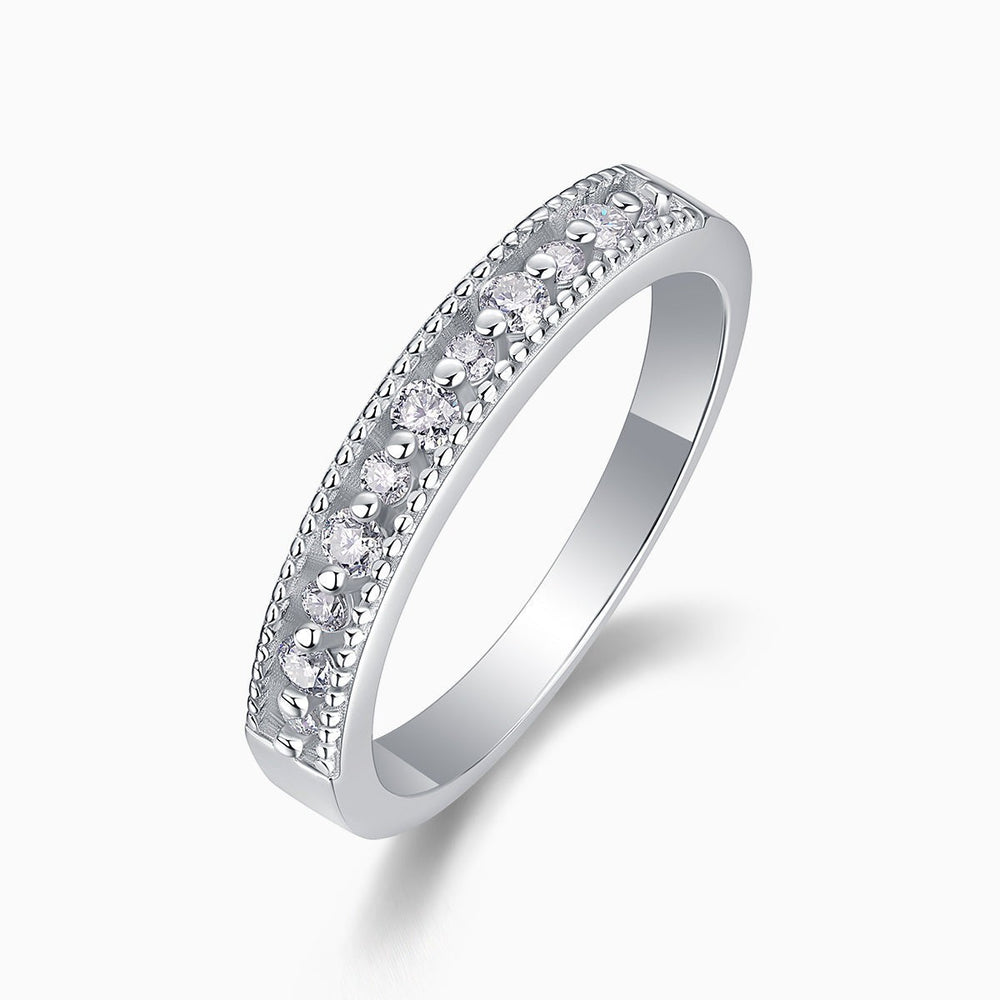 Moissanite half pavé eternity band in white gold vermeil with bezel-set round stones