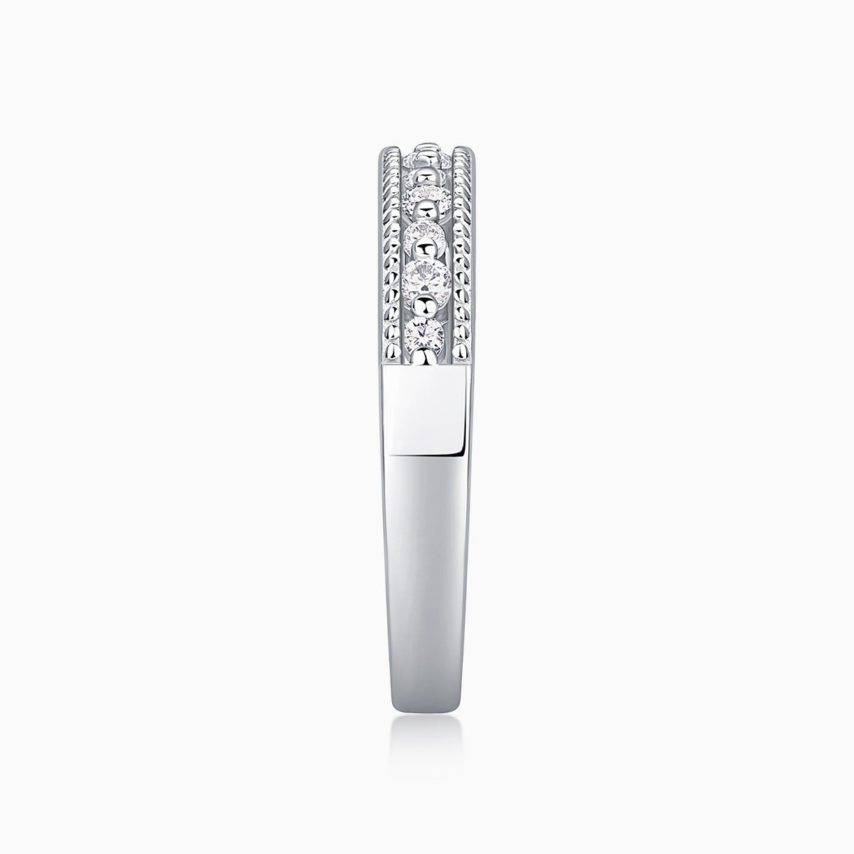 Moissanite half pavé ring side view with raised round-stone setting