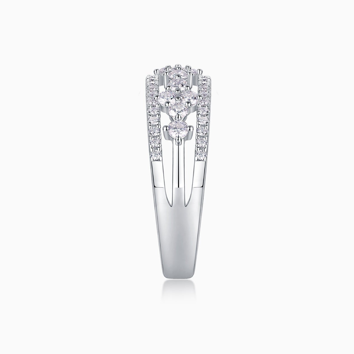 Moissanite half-row wedding band profile showing bezel settings and pavé side stones