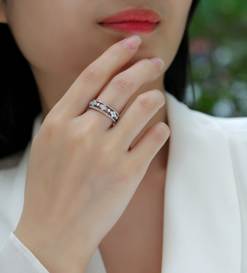 White gold vermeil half-row moissanite wedding band on finger with bright pavé accents