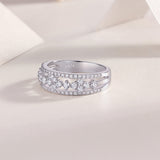 Half-row moissanite wedding band with bezel-set stones and pavé detailing, white gold vermeil