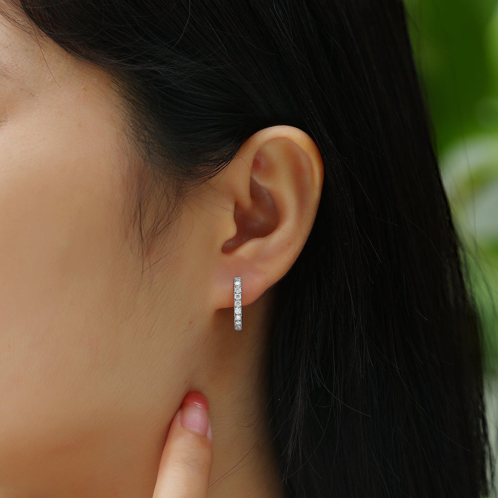 White gold vermeil pavé hoop earrings on ear, vertical row of square stones