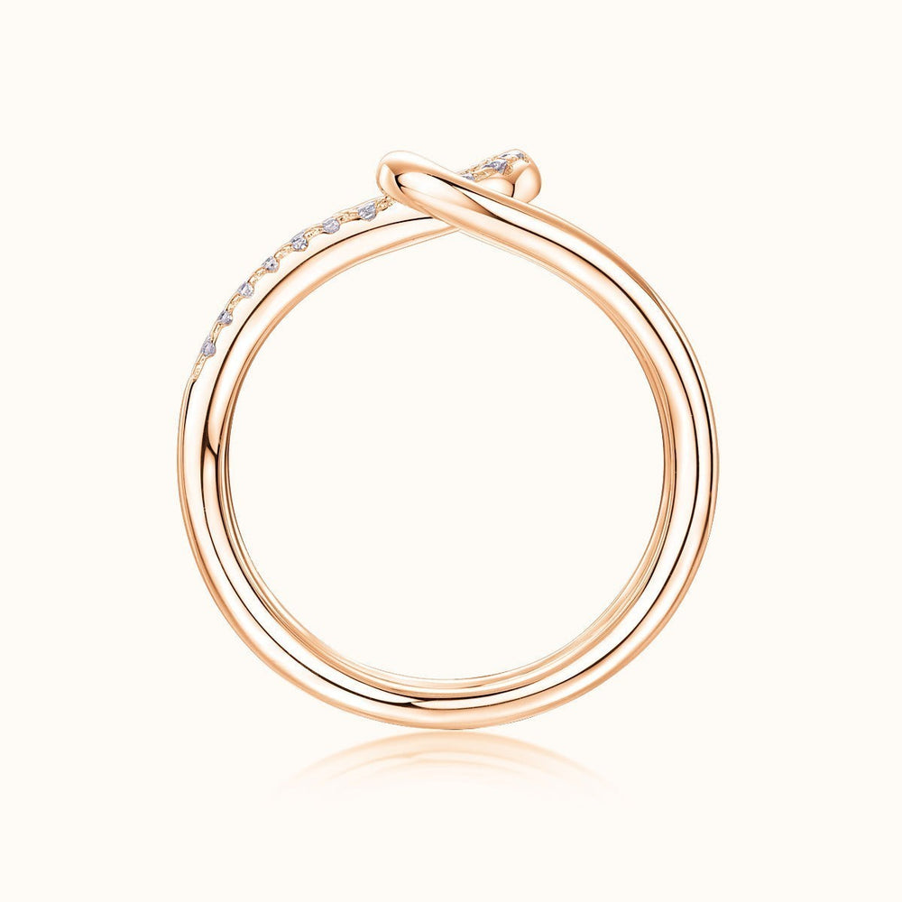 Rose gold tone wide band ring, smooth back profile with pavé on top edge