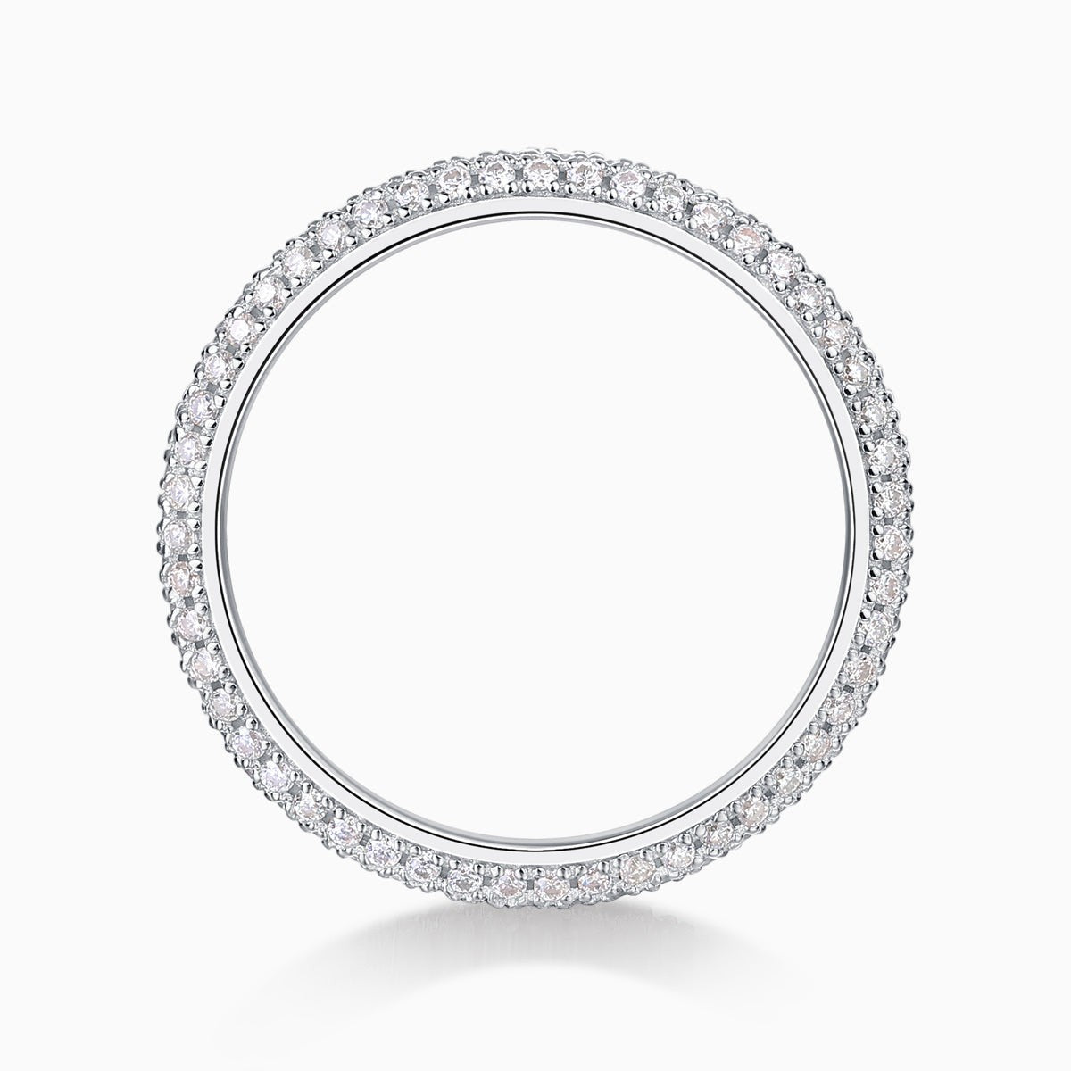Round moissanite pavé wedding band top view, stones evenly set around the band
