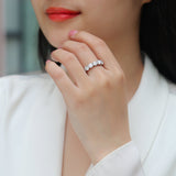 Round Moissanite Pavé wedding band on hand, white-gold vermeil, round stones