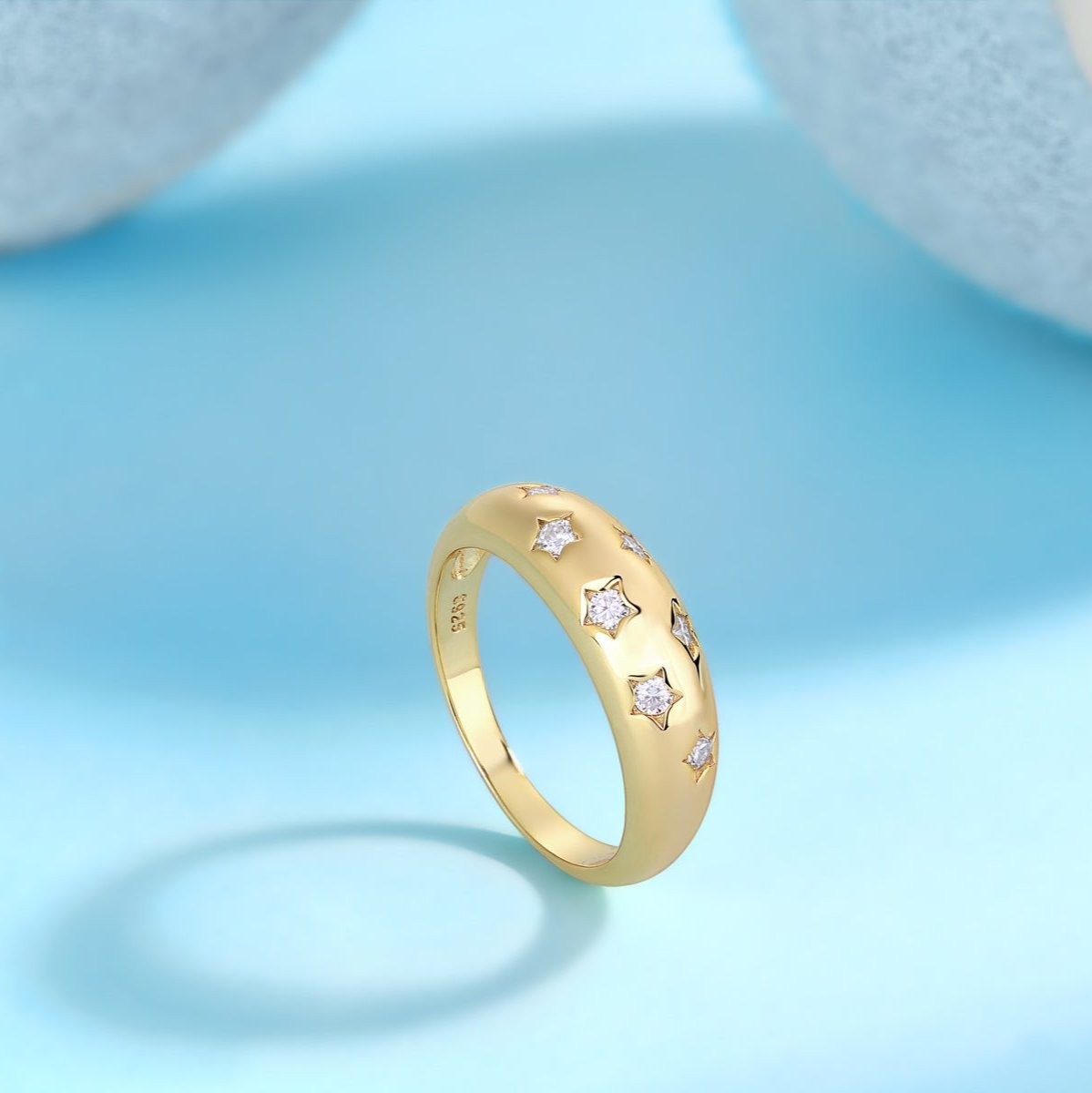 Yellow gold vermeil dome band ring with four star-shaped moissanite stones