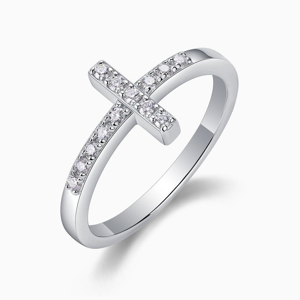Moissanite cross band ring, angled view showing pavé cross detail and band